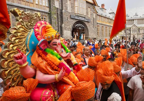 Shimla: Devotees carry an idol of Lord Ganesha to the installation site at Middle Bazaar during Ganesh Chaturthi celebrations in Shimla, Himachal Pradesh, on Monday, September 14, 2026.