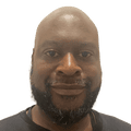 Bald man with beard in black T-shirt
